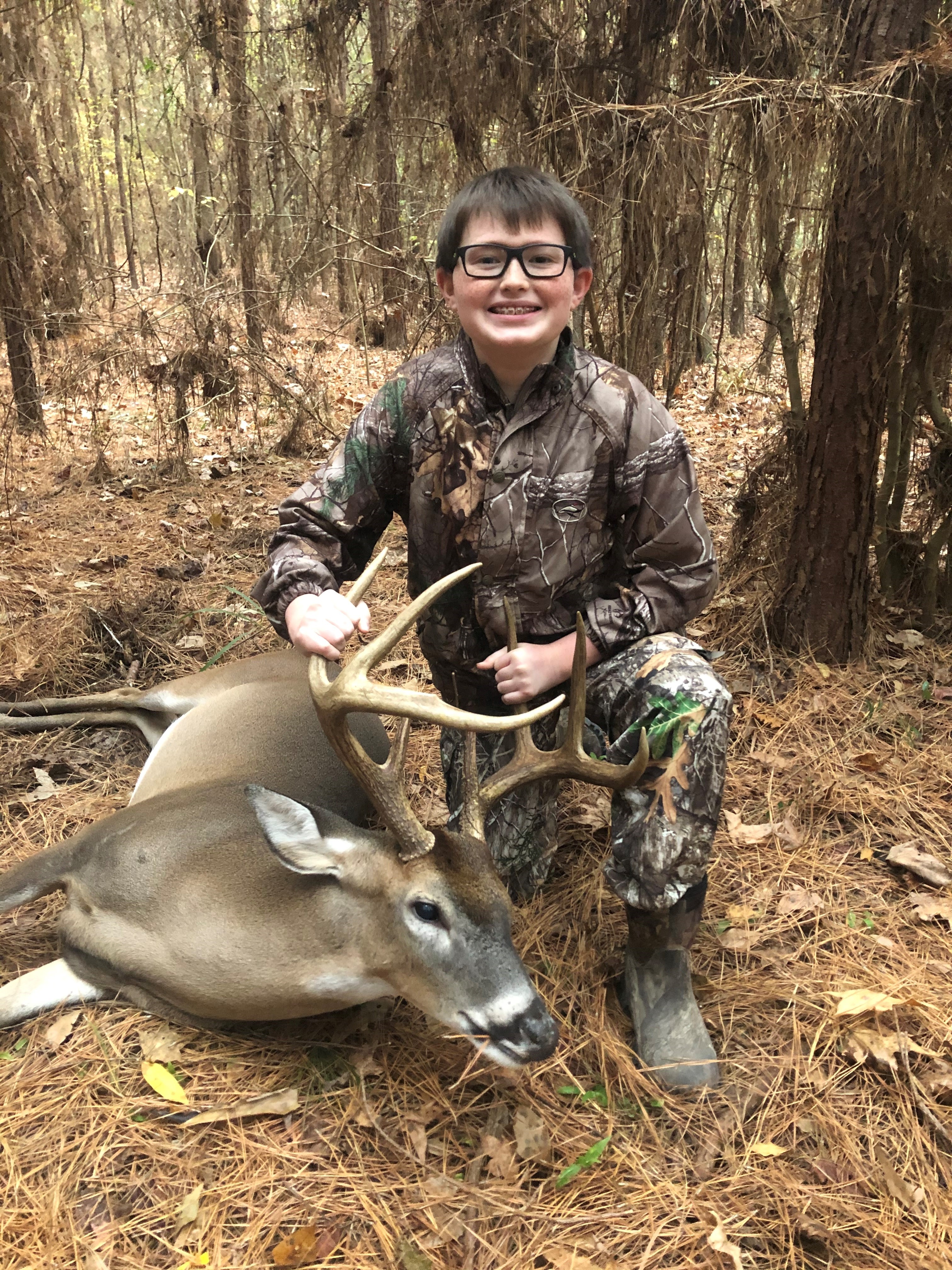 boy with his trophy buck